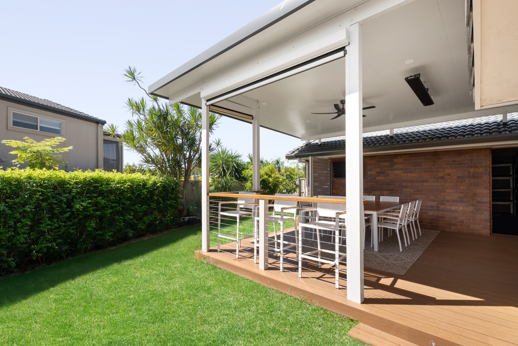 Insulated patio over a timber deck, with a breakfast bar and outdoor dining